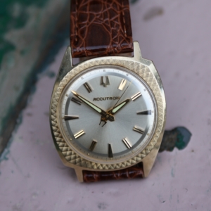 bulova accutron 14k gold
