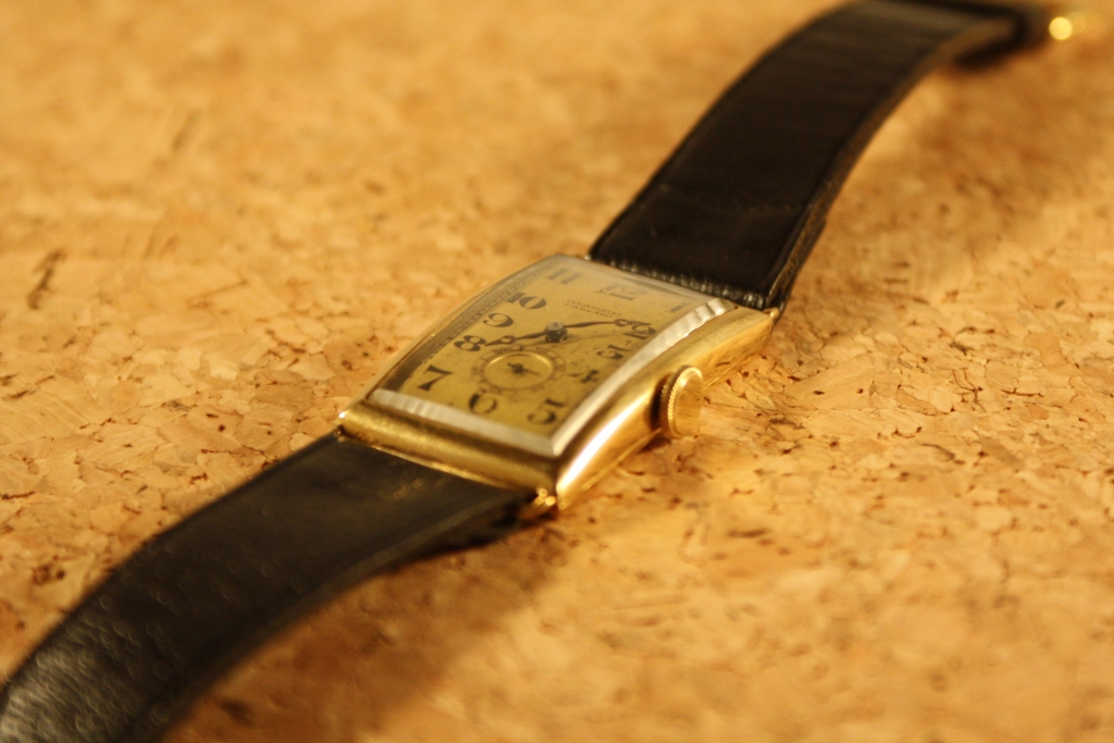 Movado Rectangular 18k gold wristwatch circa 1920's | Vintage Times